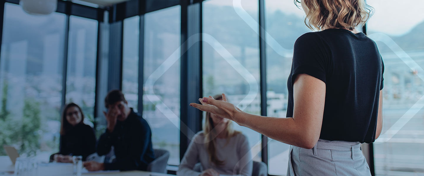 POS solutions image - woman speaking to people in an office