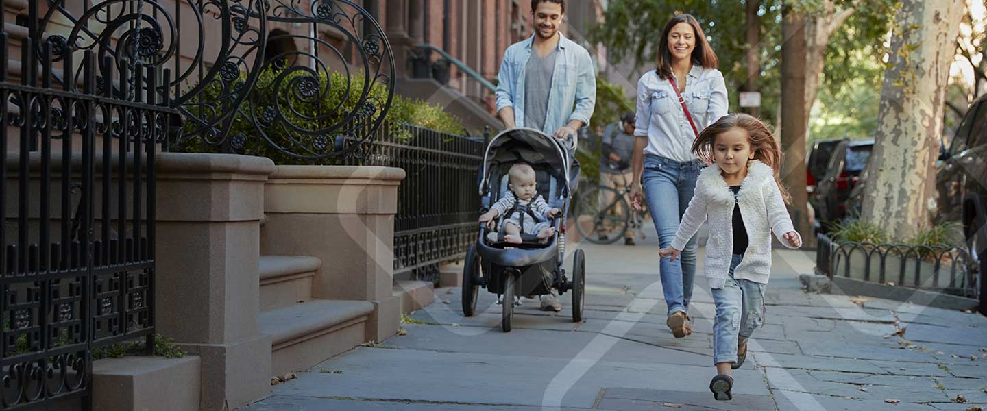 family walking down a city street