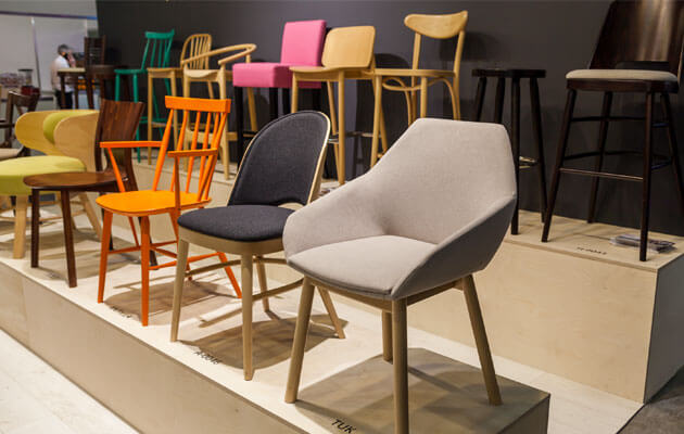 display of wood and cloth chairs in store