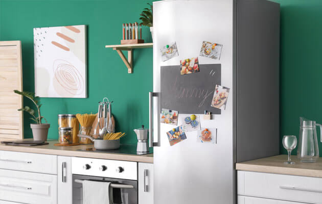 Fridge with chalk board and family photos on door