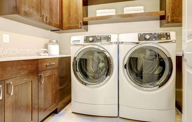 laundry room with front loading washer and dryer