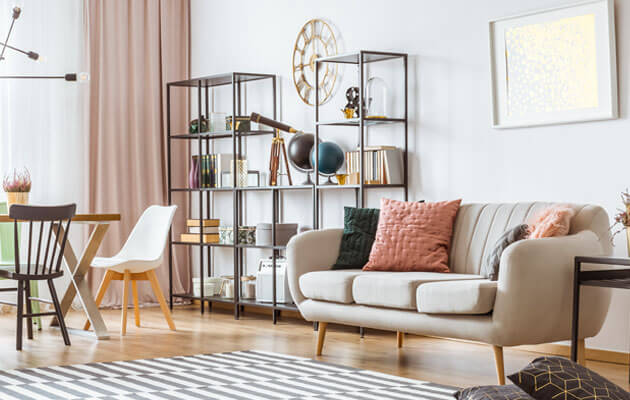 modern living room sofa with metal bookshelf behind