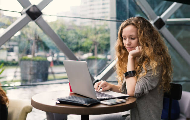 woman working on laptop in office building