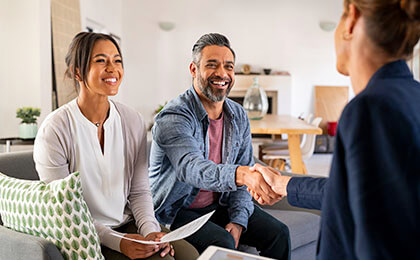 Couple Shaking Hands With Agent