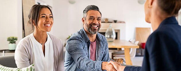 Couple Shaking Hands With Agent