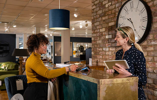 Woman Paying With Credit Card