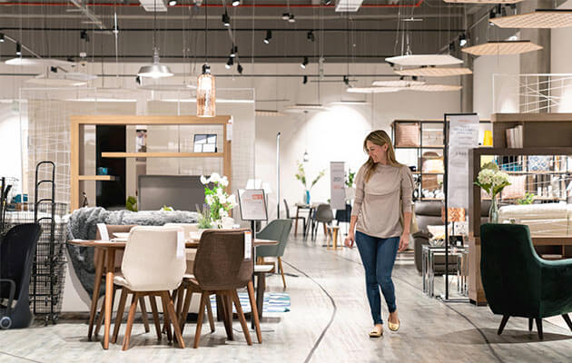 Woman Looks At Dining Set