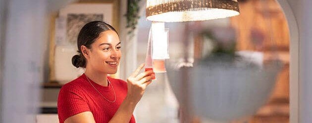 Woman Looks At Lamp Price