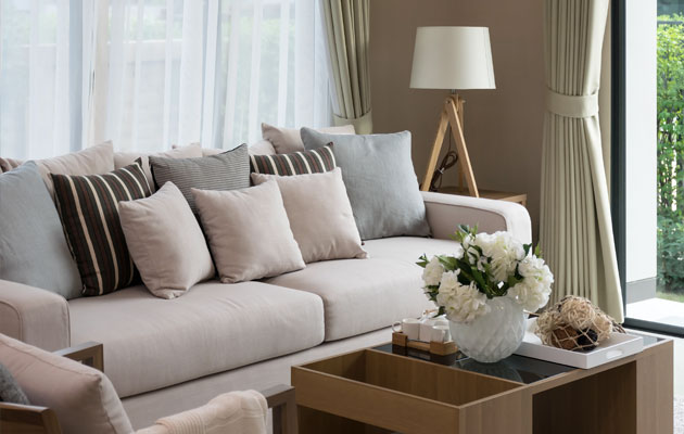 living room couch in cream and brown with sofa table