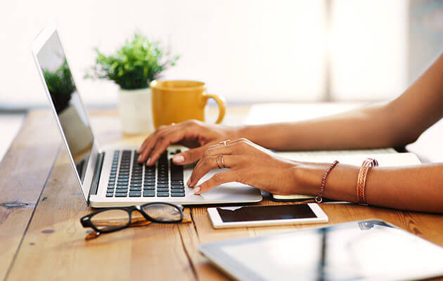 person typing on laptop