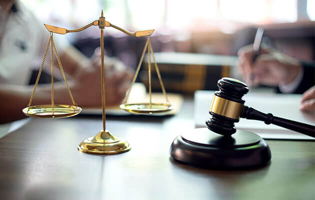 Scale and gavel on the table