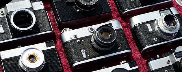 cameras being displayed on red carpet