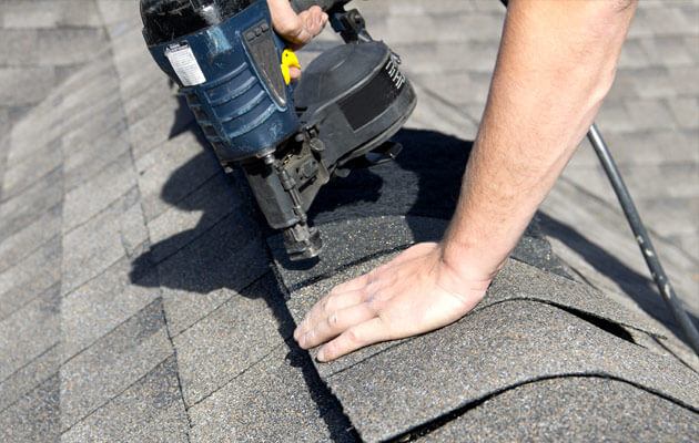 installing roof shingles