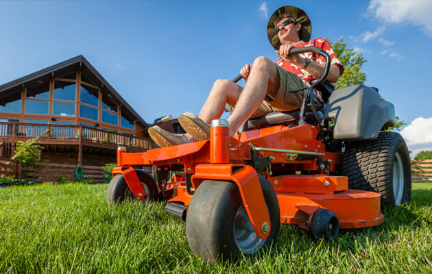 man riding zero turn mower big yard