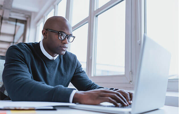 African american businessman working on his laptop