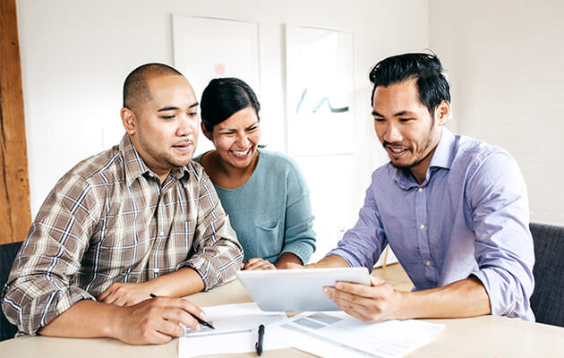 Couple being consulted and signing papers