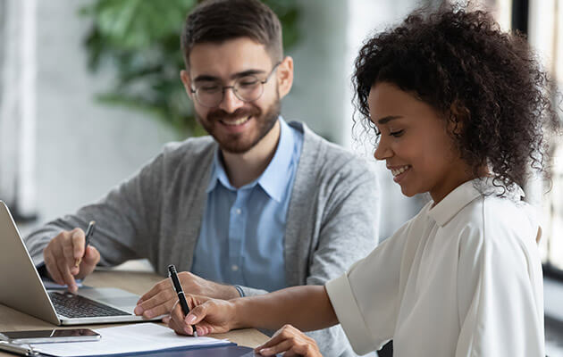 Woman being consulted and signing contracts