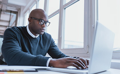 African american businessman working on his laptop