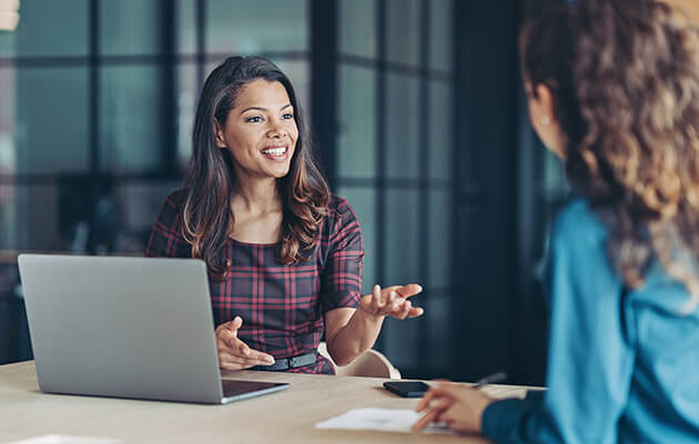 Businesswomen having a conversation in the office