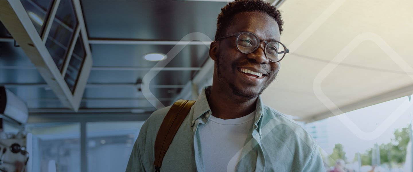 man with glasses smiling laughing