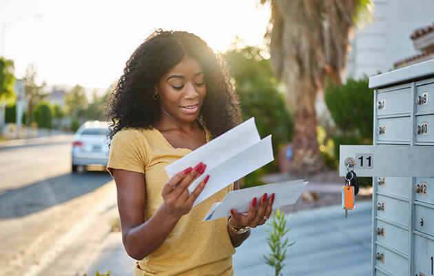 Woman checking her mail.