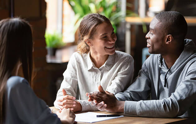 happy couple being consulted and discussing