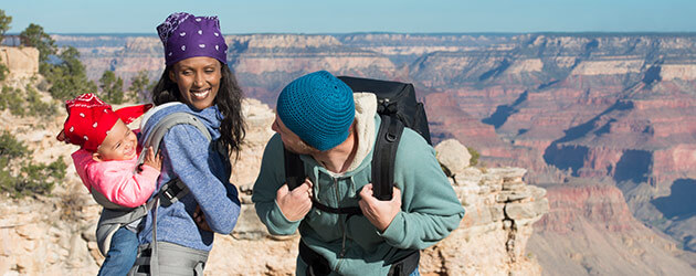 family having fun hikes through mountains and deserts