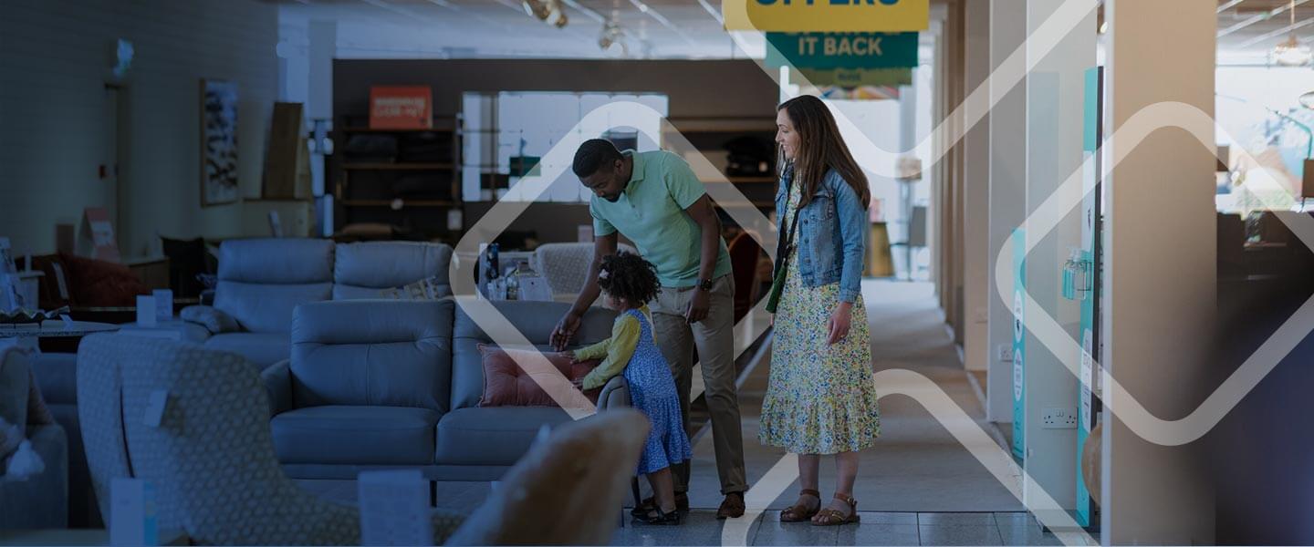 interracial family looking and shopping for furnitures in store.