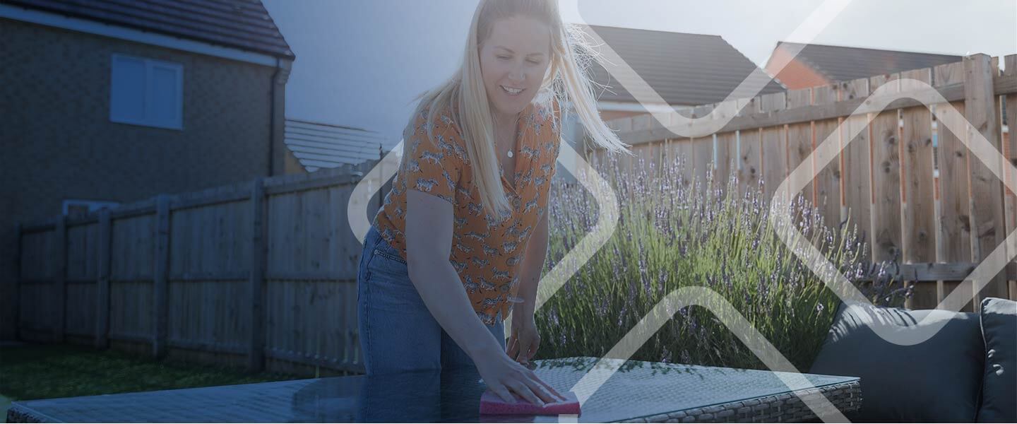 women cleaning and wiping table outdoor.